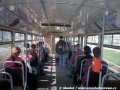 V interiéru vozu T3 ev.č.1500 zaujme kromě již popsaných úzkých oken také původní provedení sedaček s koženkovým potahem a velkým přidržovacím madlem. Tyto sedačky byly v roce 1998 v Brně ještě na několika vozech běžně v provozu, zatímco v Praze byly na všech starších vozech sedačky vyměněny za laminátové. Snímek byl pořízen na příjezdu do smyčky Bystrc, Ečerova | 18.4.1998