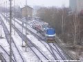 Lokomotiva 740 469-2 posunuje přes pražské zhlaví železniční stanice Praha-Zličín vůz Škoda 14T ev.č.9122 k rampě předávací koleje. | 22.3.2007
